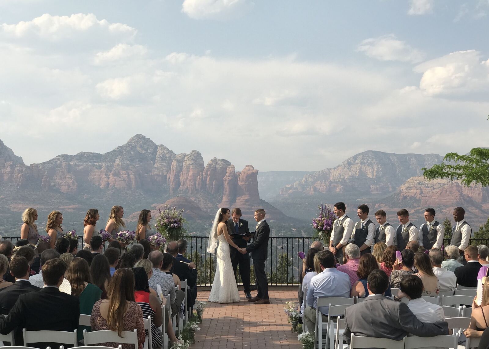 Cliffside wedding ceremony above red rock