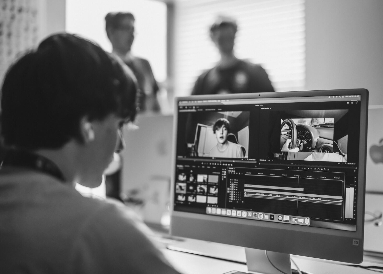 Black-and-white student editing in Premiere