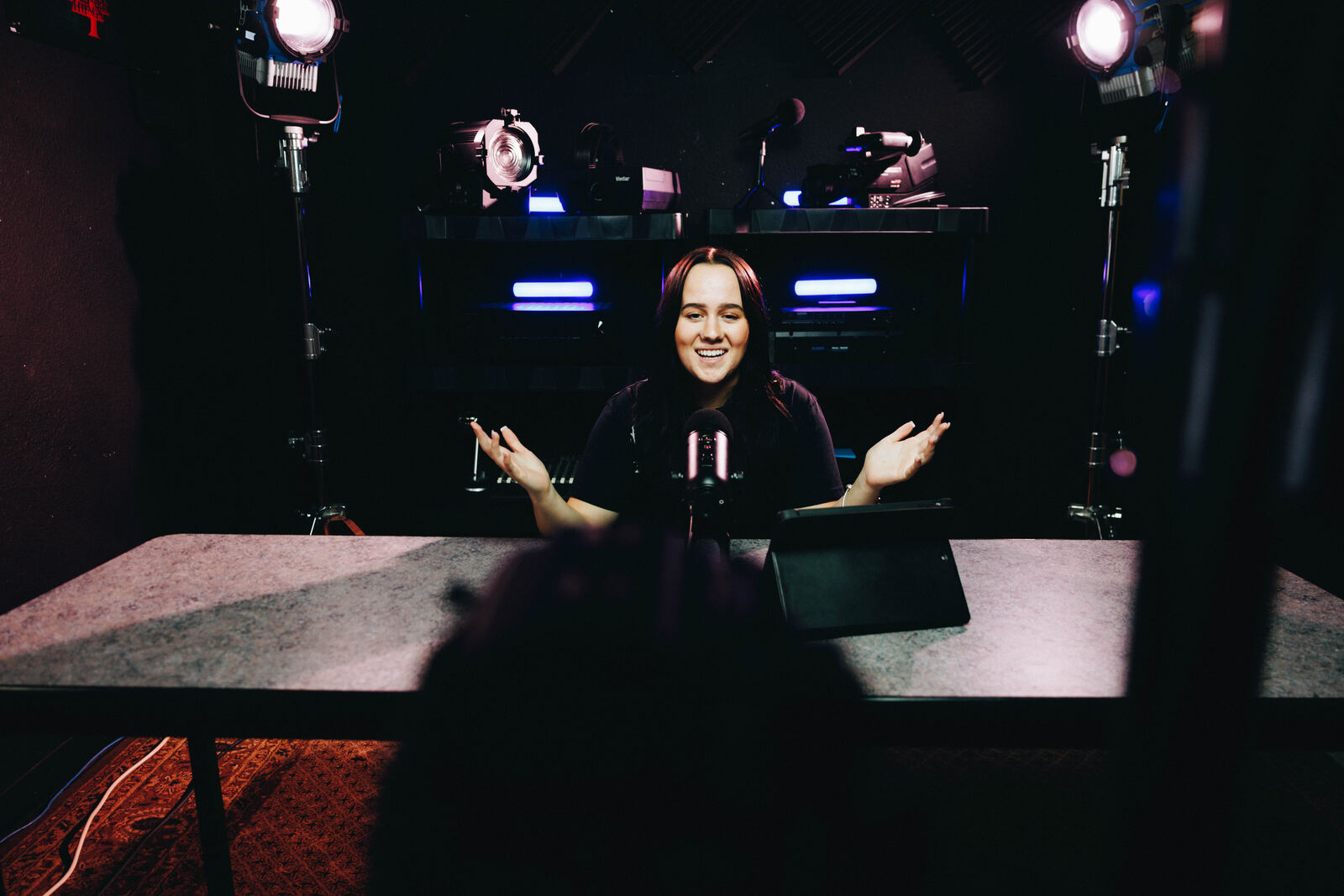 Student anchor on the broadcast set