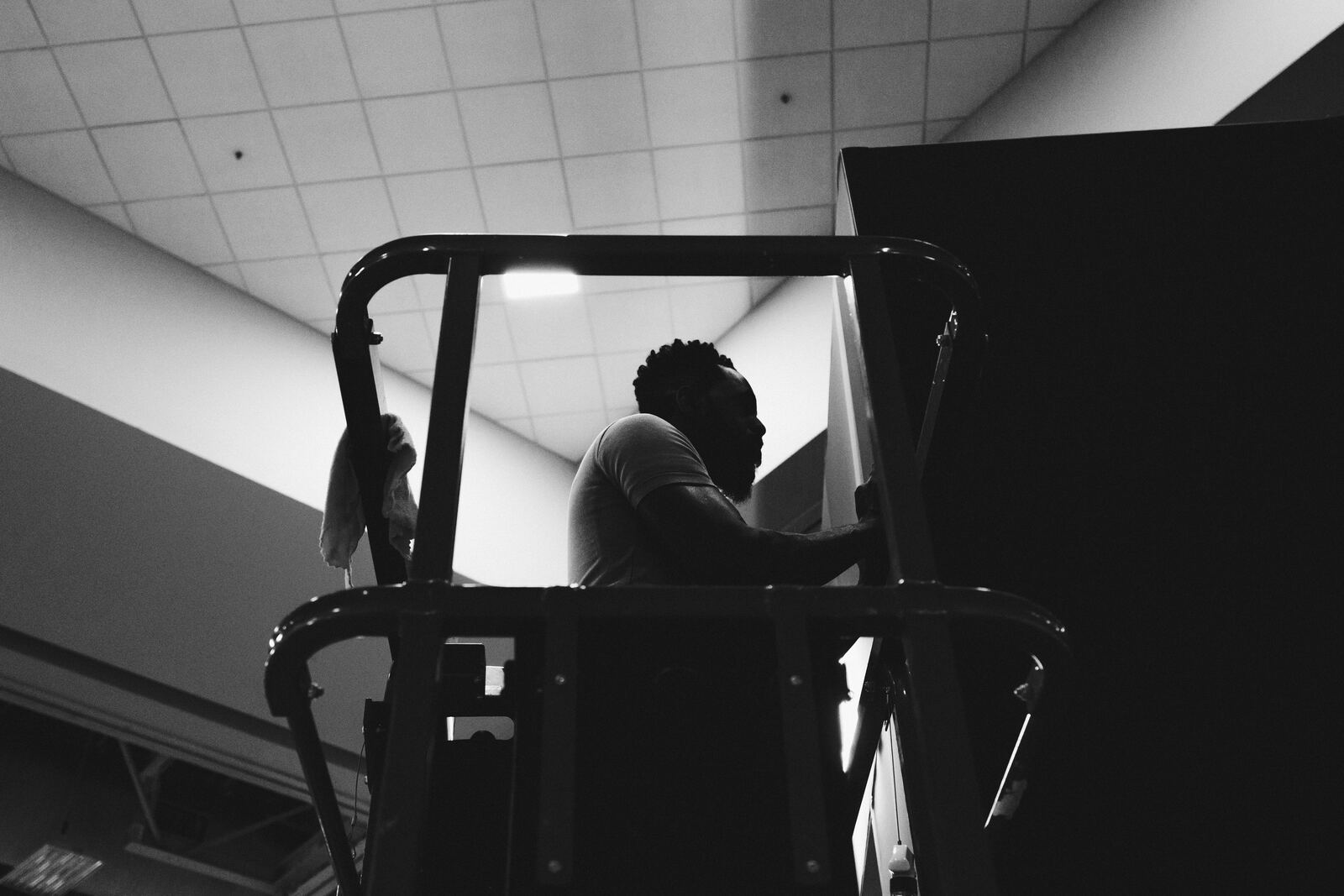 Black-and-white silhouette on a lift